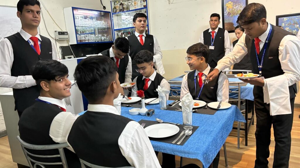 ABHI students practising restaurant service in the F&B lab